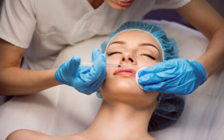 female patient receiving injection her face